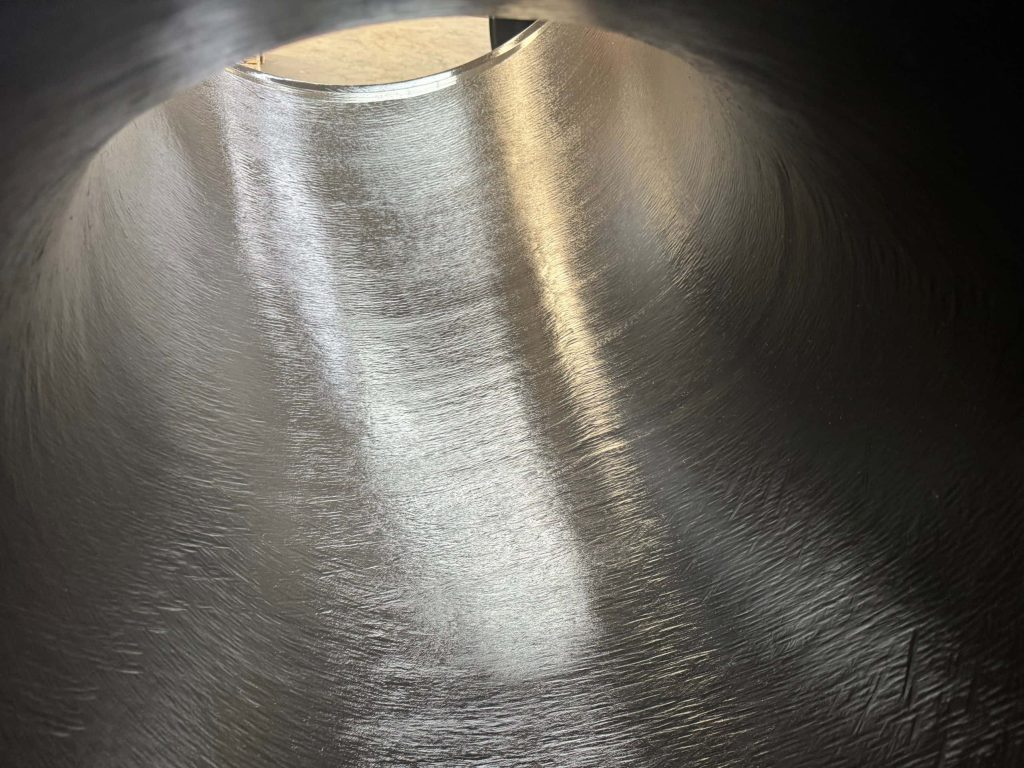 The internal surface of the pipe fitting after sandblasting